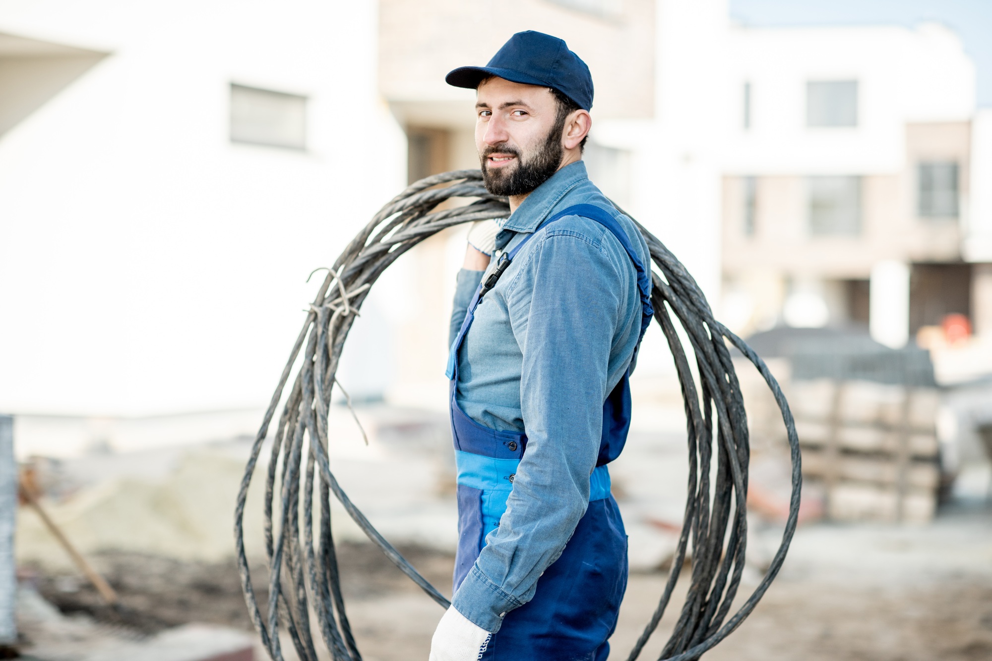 Electrician portrait with power cable